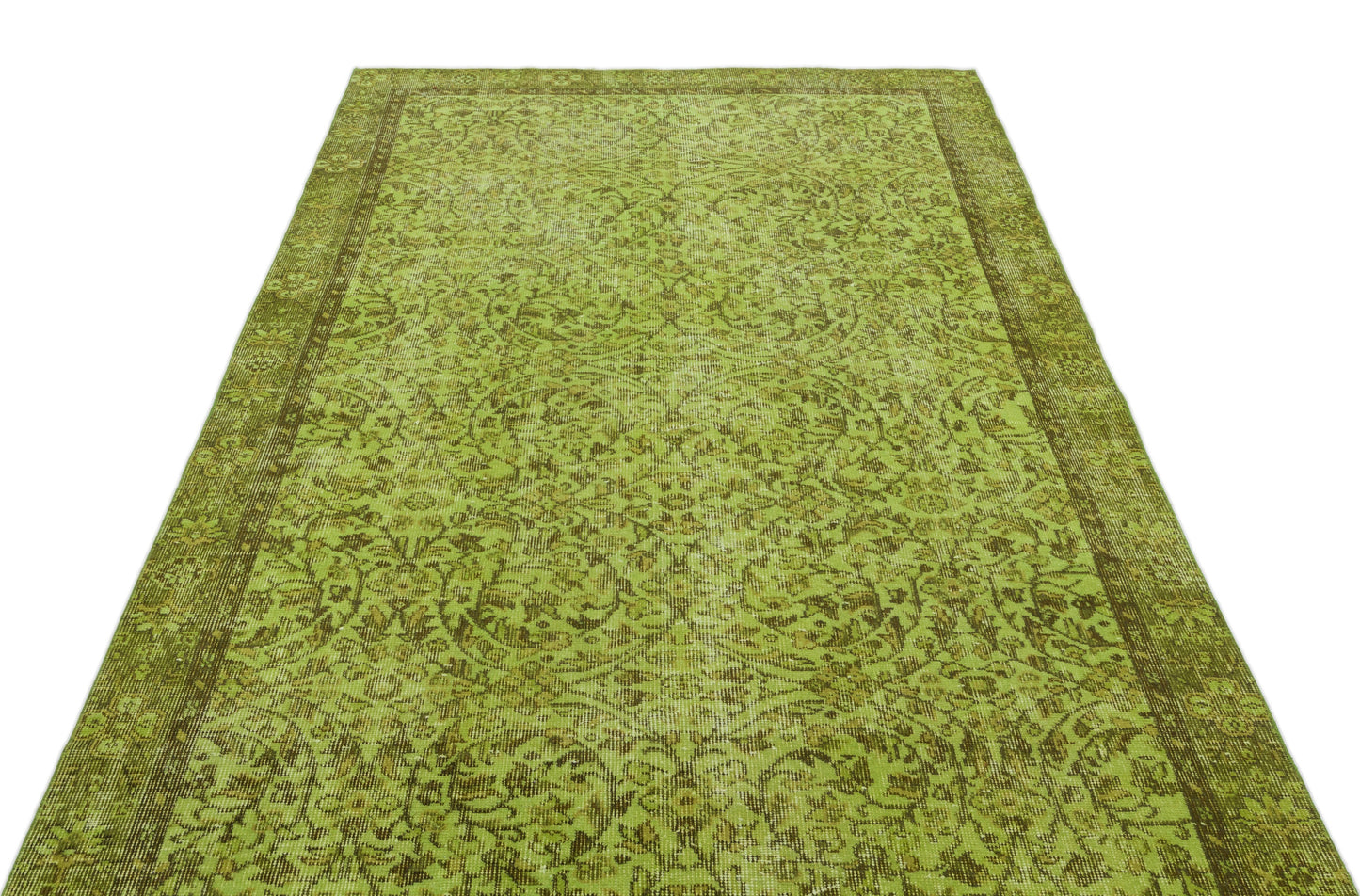 Chartreuse and olive green vintage-style rug with a distressed floral medallion pattern and a wide border.