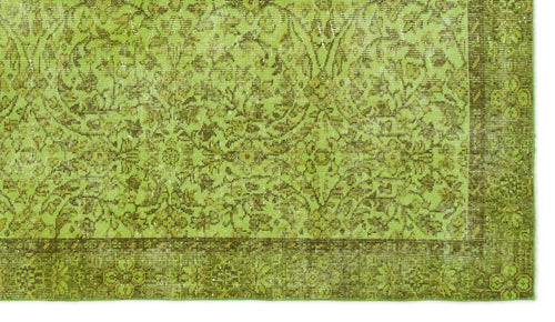 Load image 1 in gallery view. Chartreuse and olive green rug with a distressed traditional floral medallion pattern and a wide decorative border.