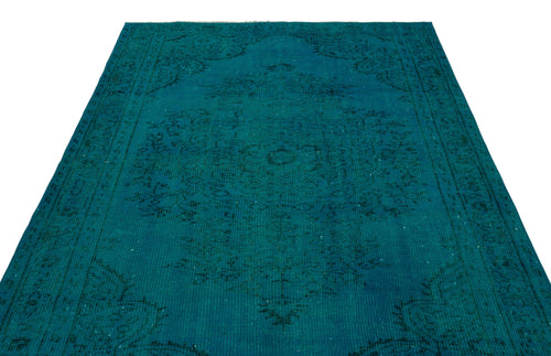 Load image 1 in gallery view. Teal vintage-style rug with a faded black traditional medallion pattern on a white background.