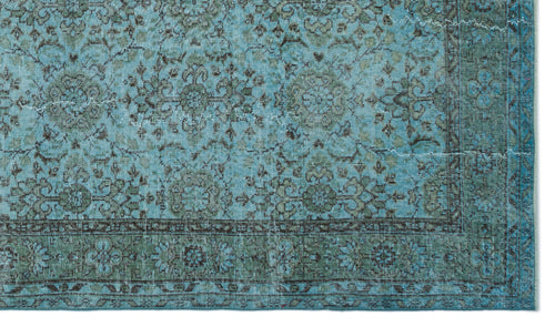 Load image 1 in gallery view. Distressed turquoise and sage green rug with a traditional floral medallion pattern and a detailed border.
