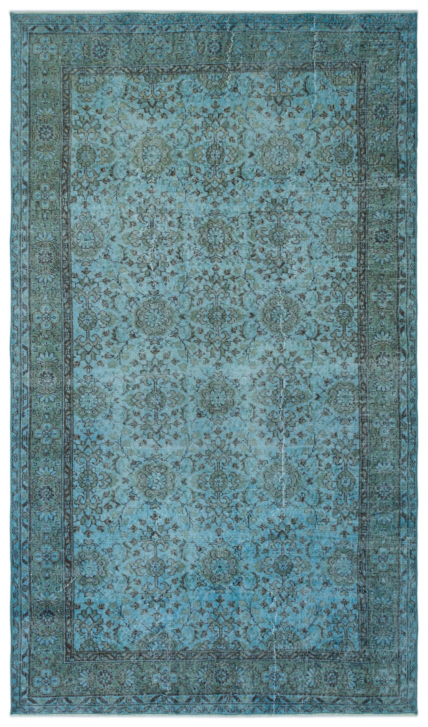 Distressed turquoise and charcoal rug with a traditional floral medallion pattern and a wide decorative border.