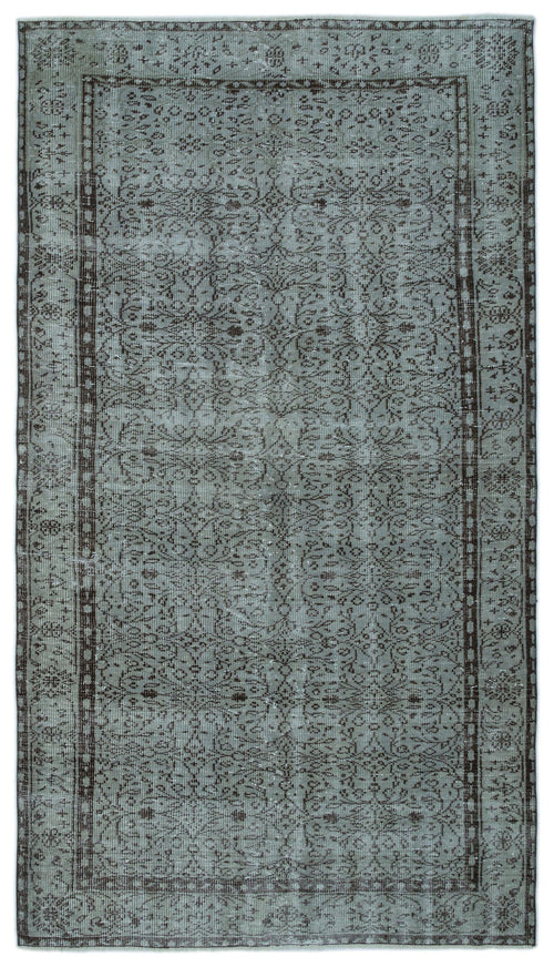 Load image 1 in gallery view. Sage green and charcoal distressed rug with a traditional floral medallion pattern and a decorative border.