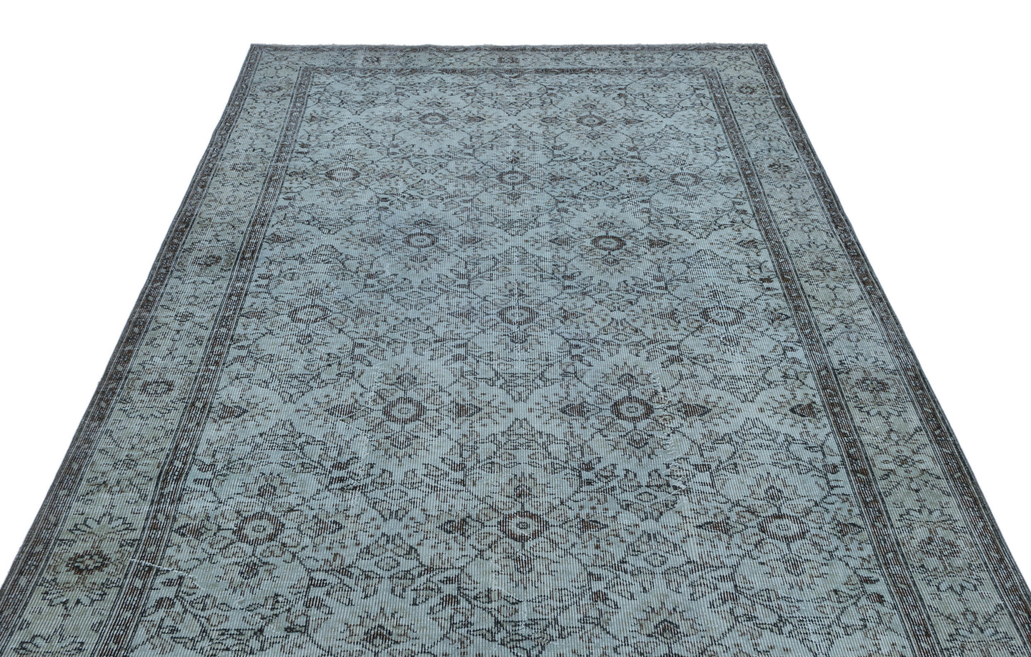 Light blue and charcoal grey rug with a traditional distressed floral medallion pattern and a bordered edge.
