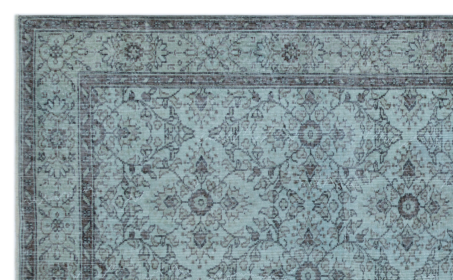 Light blue and dark brown traditional rug with an intricate floral medallion pattern and a decorative border.