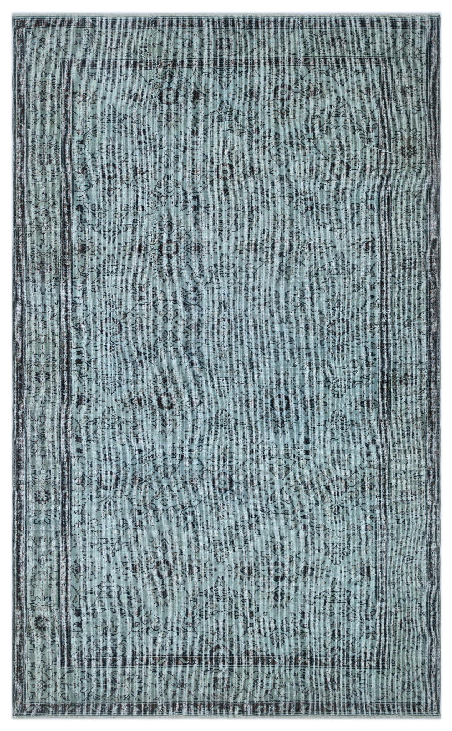 Light blue and charcoal grey traditional rug with a distressed floral medallion pattern and a bordered edge.