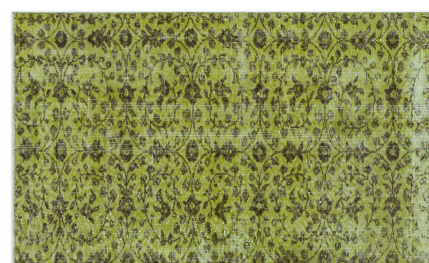 Chartreuse and dark brown vintage-style rug with a repeating floral medallion pattern and distressed texture.
