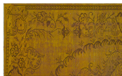 Load image 1 in gallery view. Mustard yellow rug with a dark brown floral medallion pattern and a geometric border.