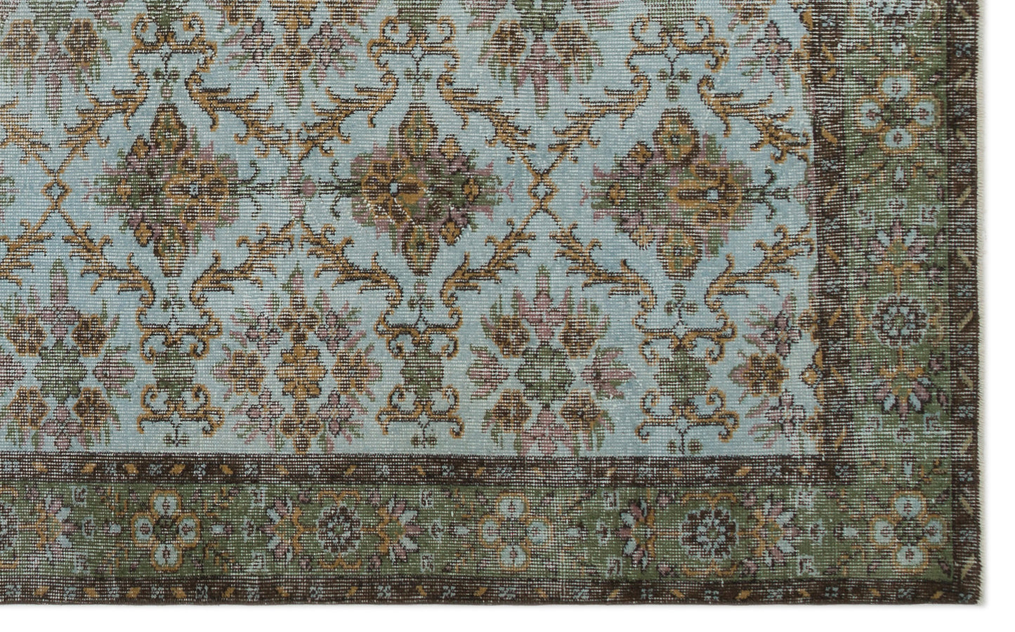 Light blue rug with a repeating floral medallion pattern in brown, gold, and pink, featuring a dark brown border.