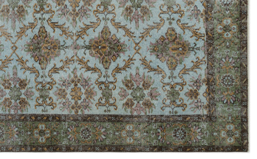 Load image 1 in gallery view. Light blue rug with a repeating floral medallion pattern in brown, gold, and pink, featuring a dark brown border.