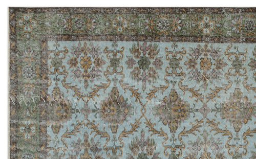Load image 1 in gallery view. Light blue traditional rug with a dark brown and olive green floral border and repeating medallion pattern.