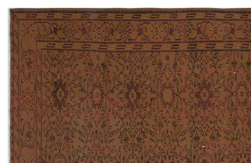 Load image 1 in gallery view. Rust and brown traditional rug with a repeating floral medallion pattern and a geometric border.