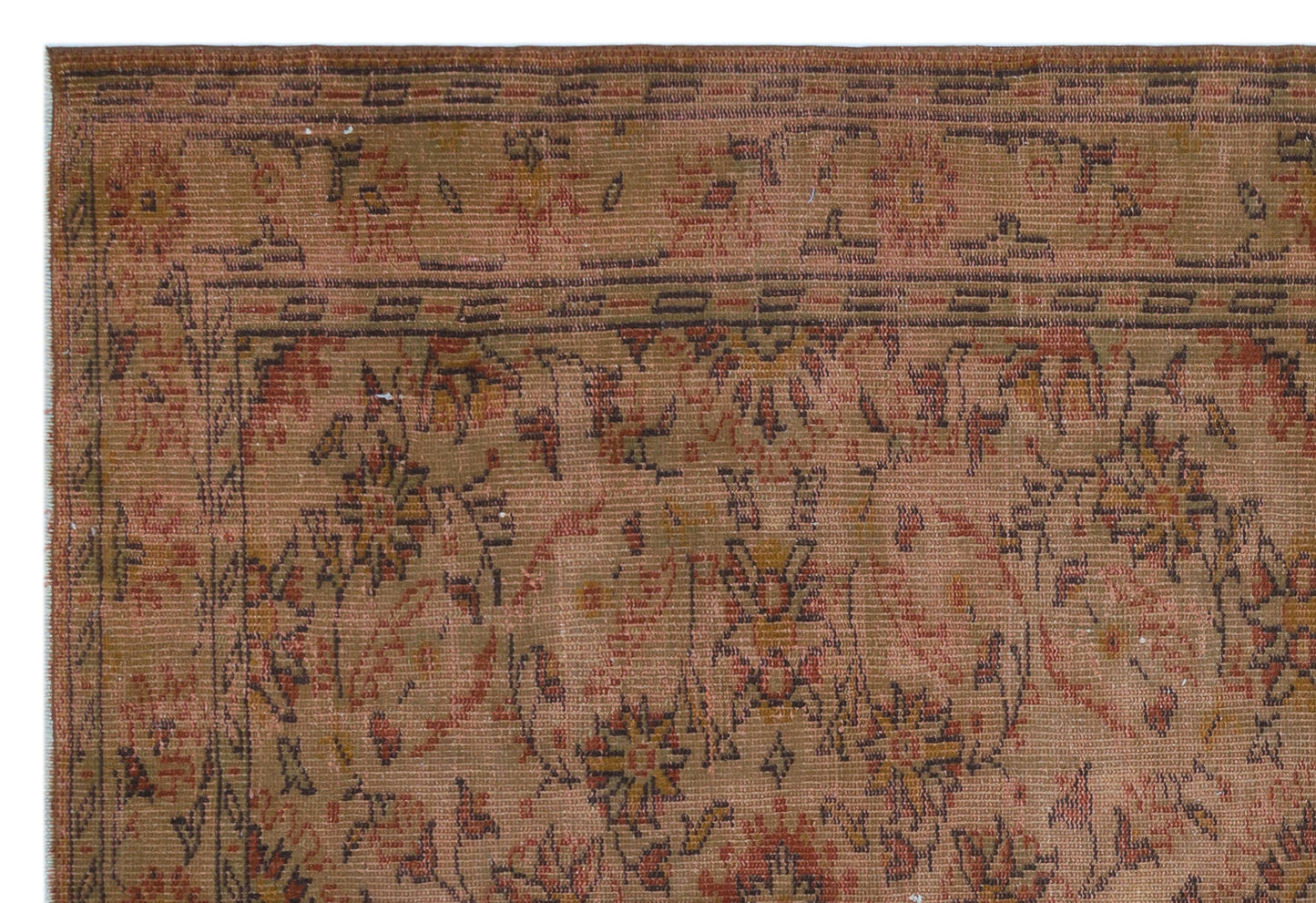 Rust and brown vintage-style rug with a faded floral medallion pattern and a geometric border.