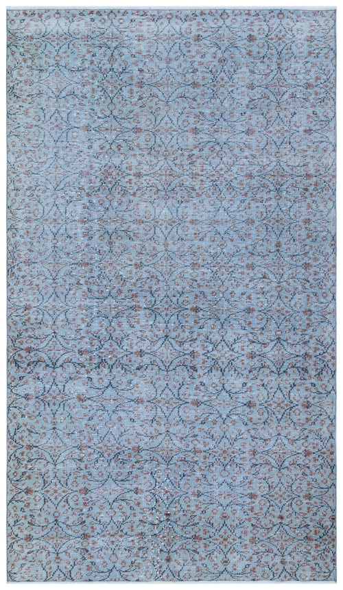 Load image 1 in gallery view. Light blue rug with a distressed, repeating dark grey and rust-colored floral medallion pattern.