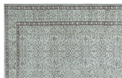 Load image 1 in gallery view. Light gray and taupe rug with a distressed traditional floral medallion pattern and a geometric border.