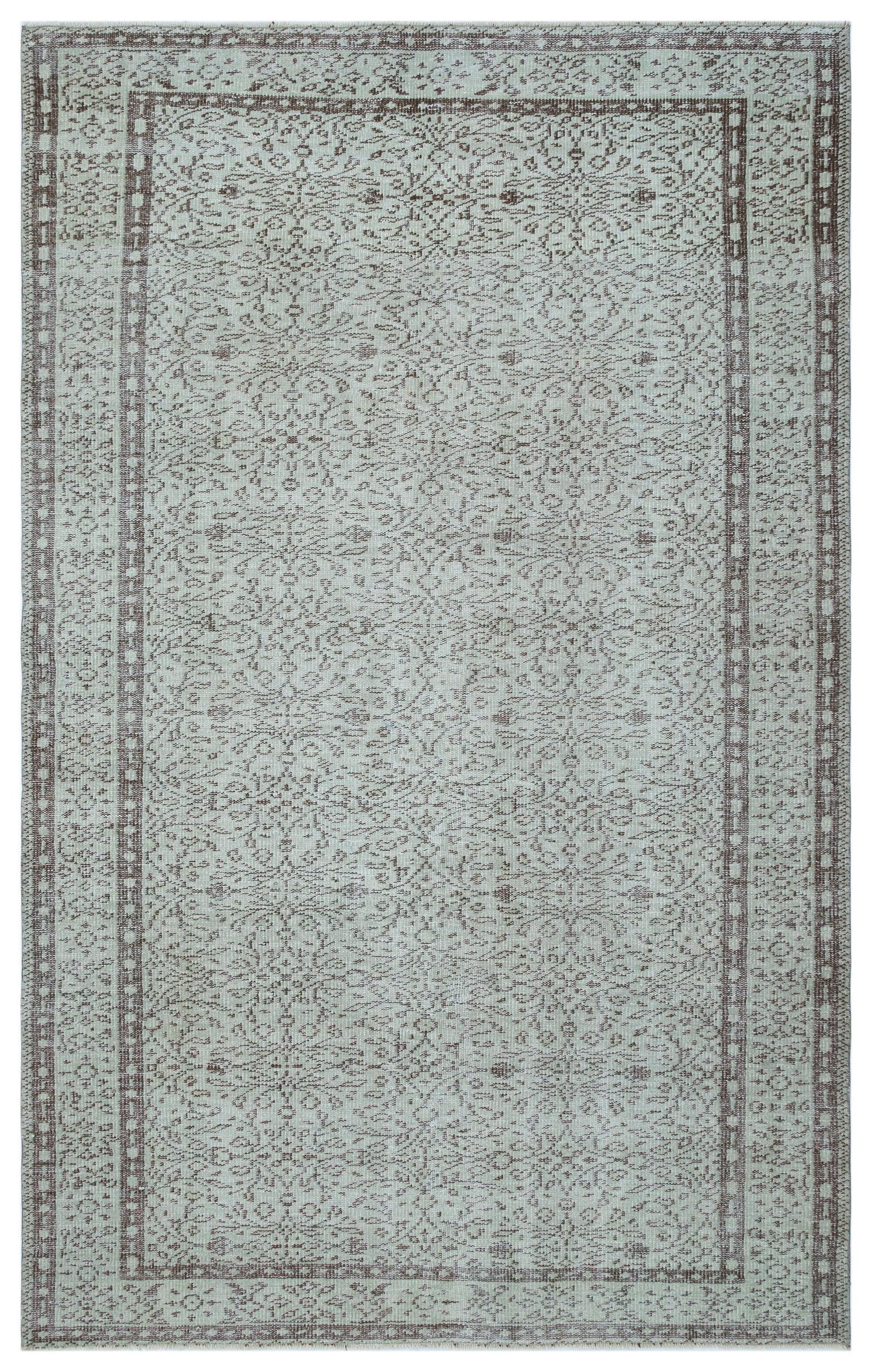 Light blue and brown traditional rug with a distressed floral medallion pattern and a geometric border.