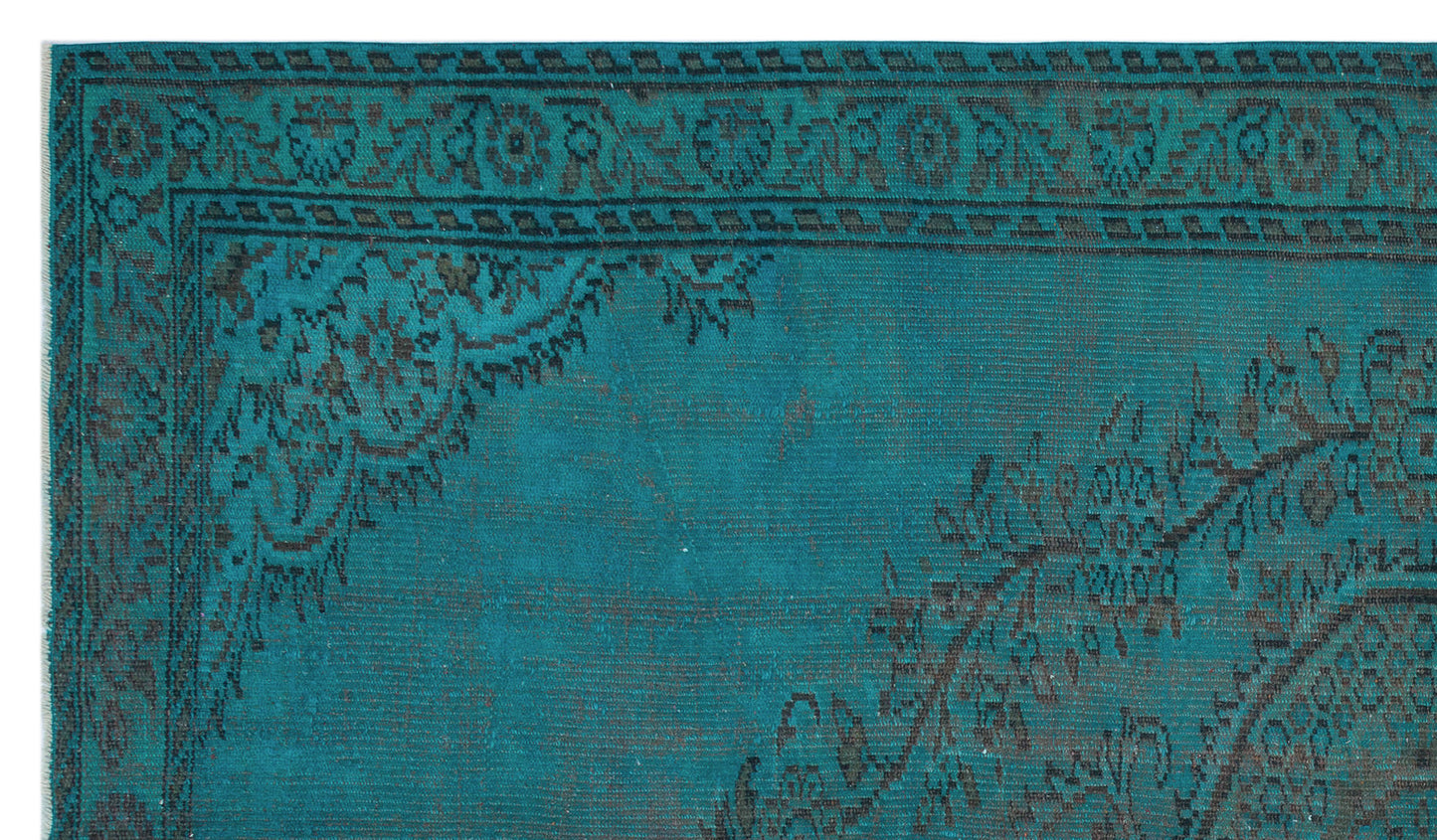 Teal and black distressed rug with a traditional floral medallion border and geometric corner detail.