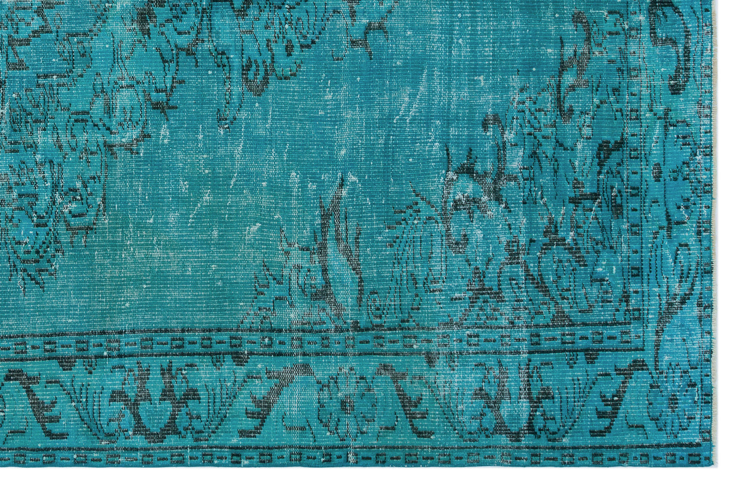 Teal and black distressed rug with a traditional floral medallion pattern and a geometric border.