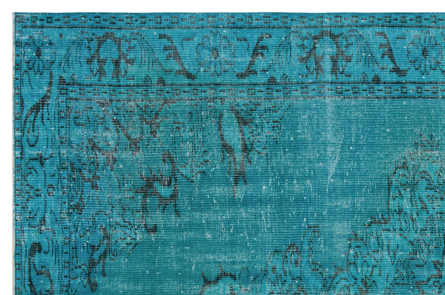 Teal and black distressed rug with a traditional floral medallion border and faded vintage pattern.