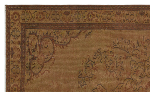 Load image 1 in gallery view. Brown and rust-colored traditional rug with a floral medallion border and intricate botanical motifs.