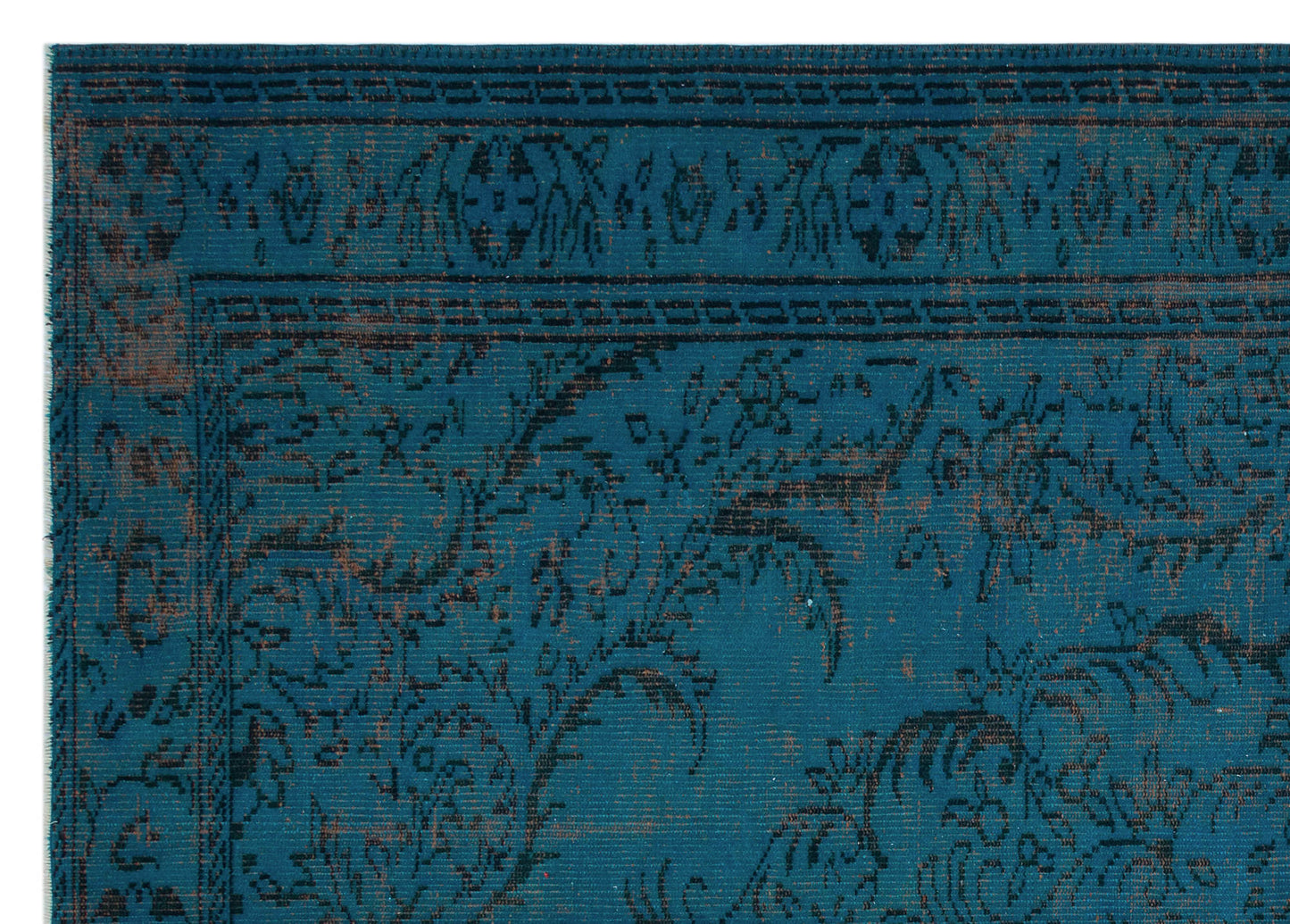 Teal rug with a distressed black and copper floral pattern and a geometric border.