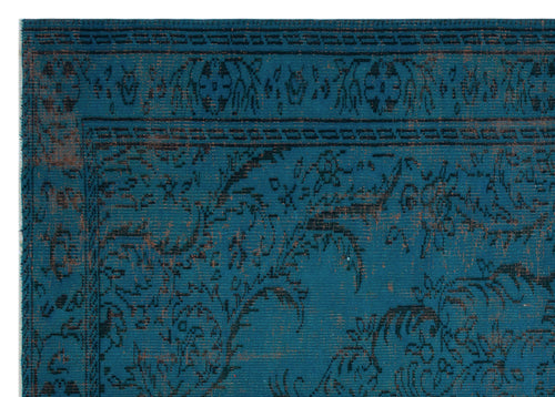 Load image 1 in gallery view. Teal rug with a distressed black and copper floral pattern and a geometric border.