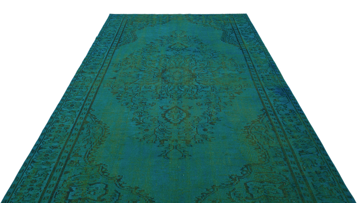 Teal and dark green traditional rug with a distressed central medallion and ornate border on a white background.