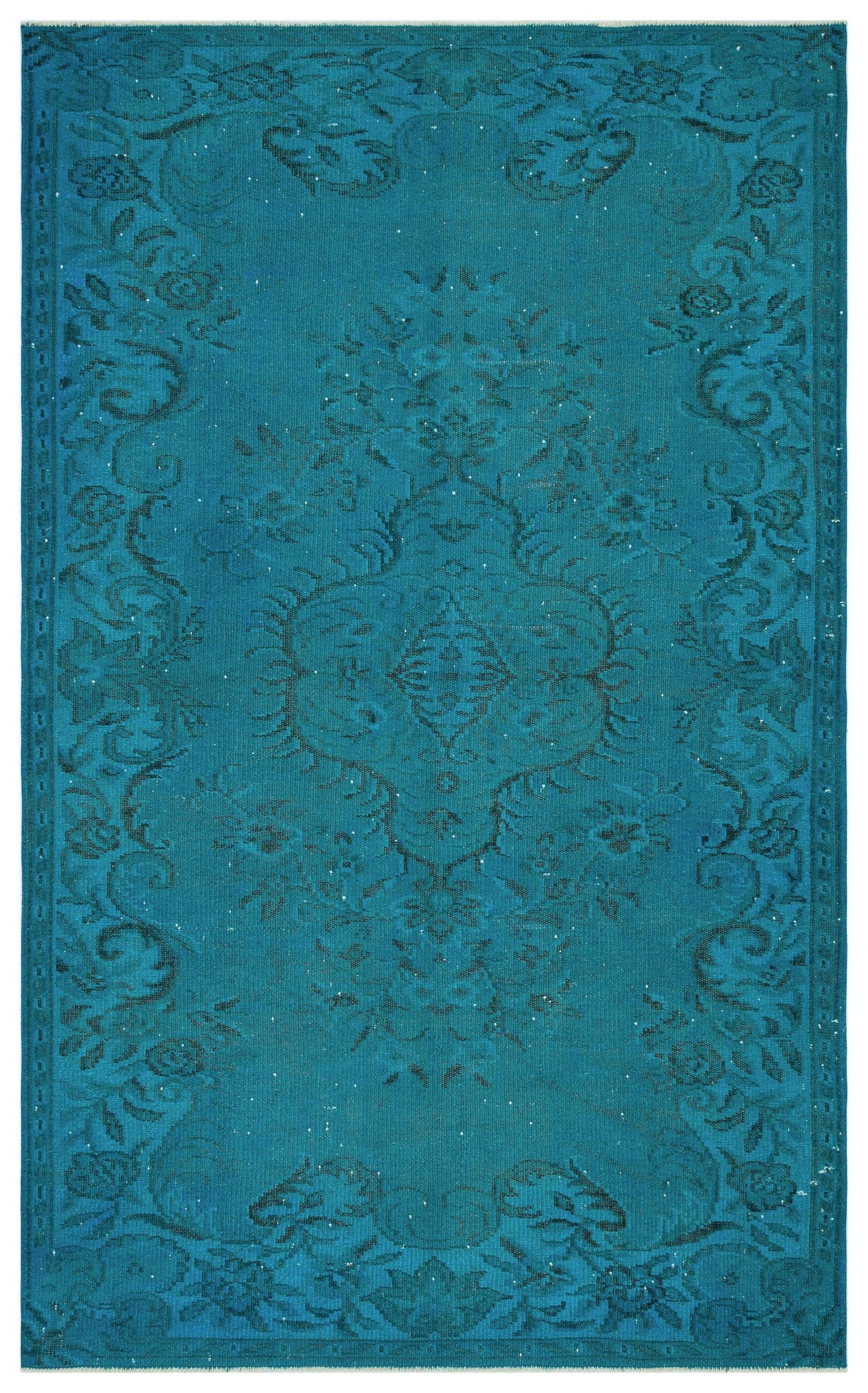 Teal area rug with a dark blue distressed floral medallion pattern and a decorative border.