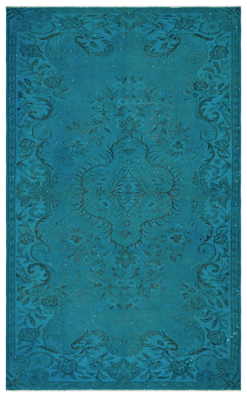 Load image 1 in gallery view. Teal area rug with a dark blue distressed floral medallion pattern and a decorative border.