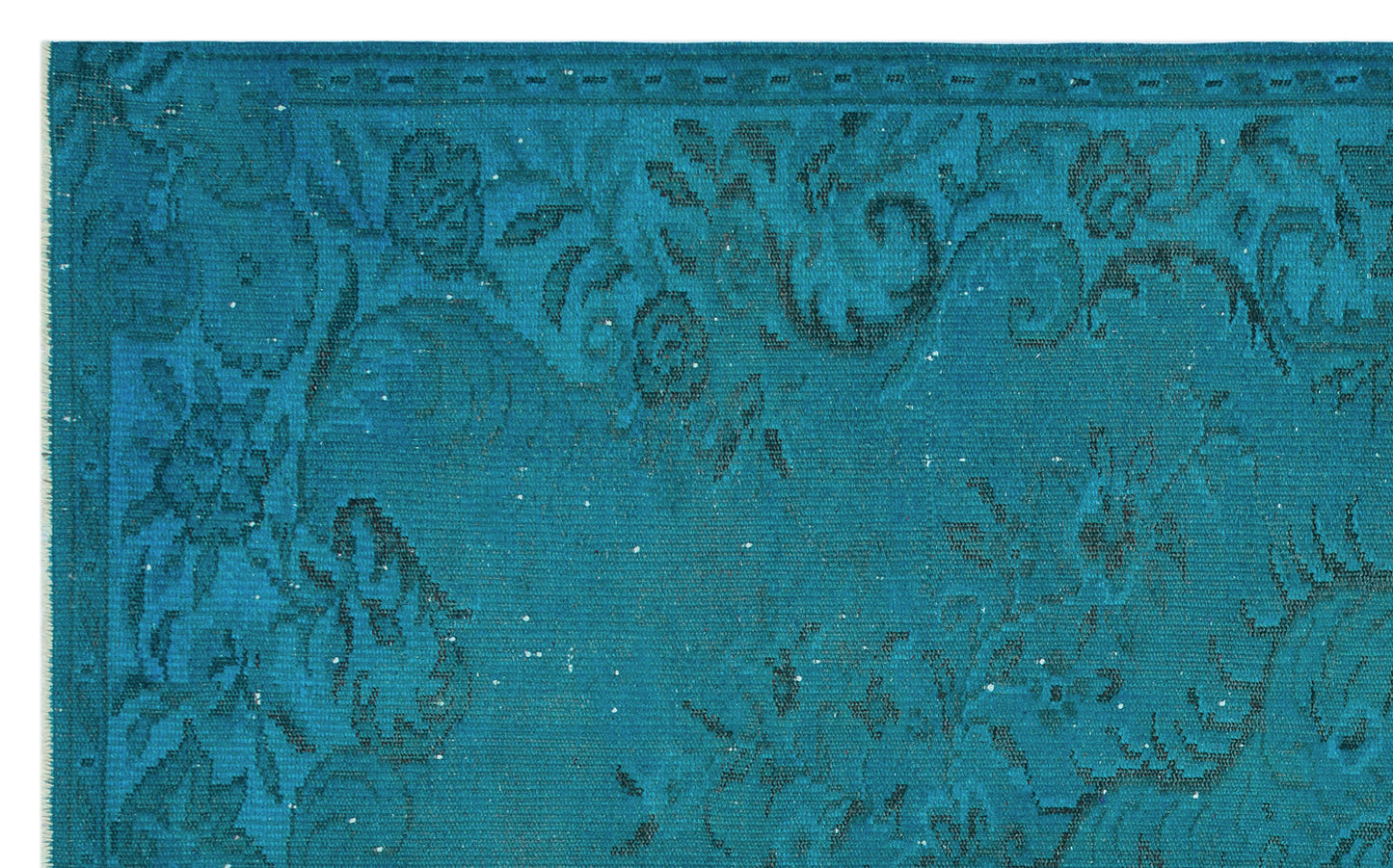 Teal rug with a dark blue distressed floral pattern and a decorative border.