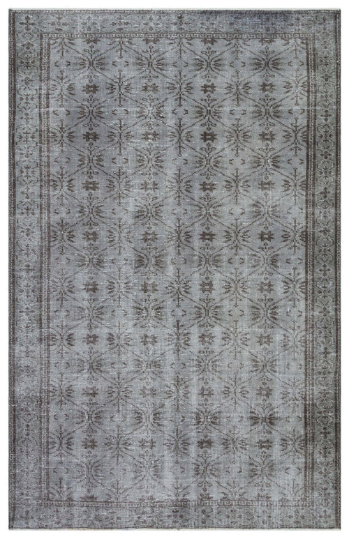 Load image 1 in gallery view. Grey and charcoal distressed rug with a repeating geometric lattice and floral motif, featuring a decorative border.