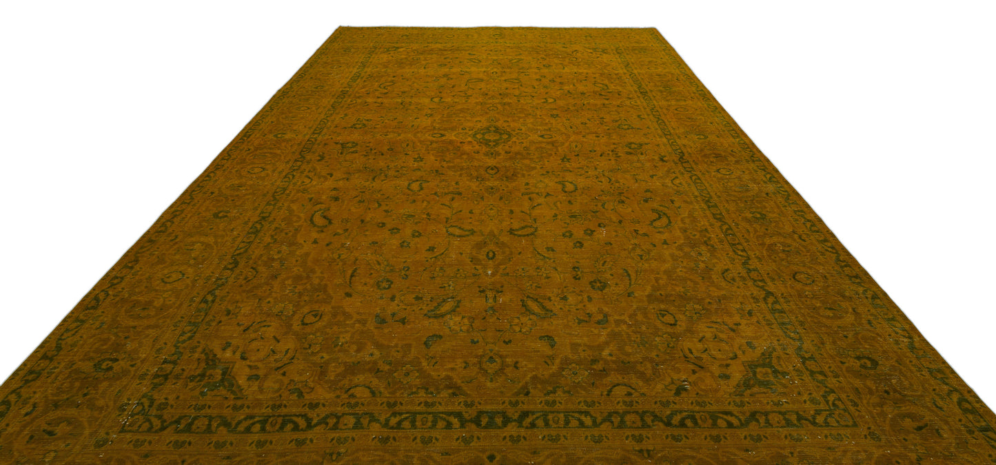 Mustard yellow traditional rug with a dark green floral medallion pattern and ornate border on a white background.
