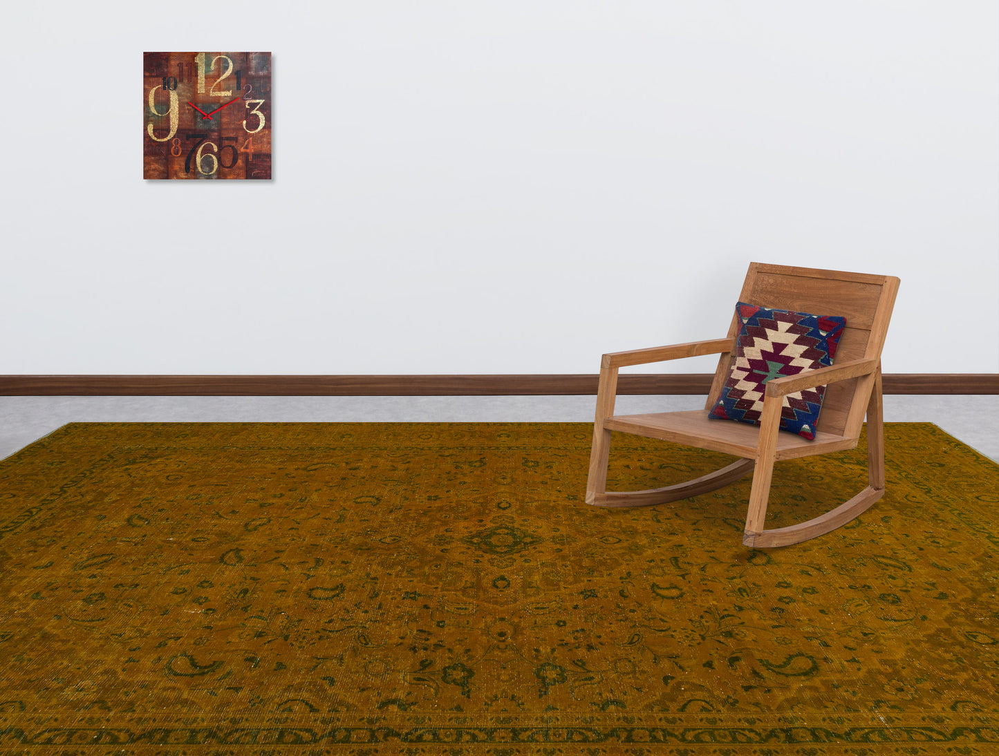 Mustard yellow traditional rug with a faded floral pattern, styled in a room with a wooden rocking chair.
