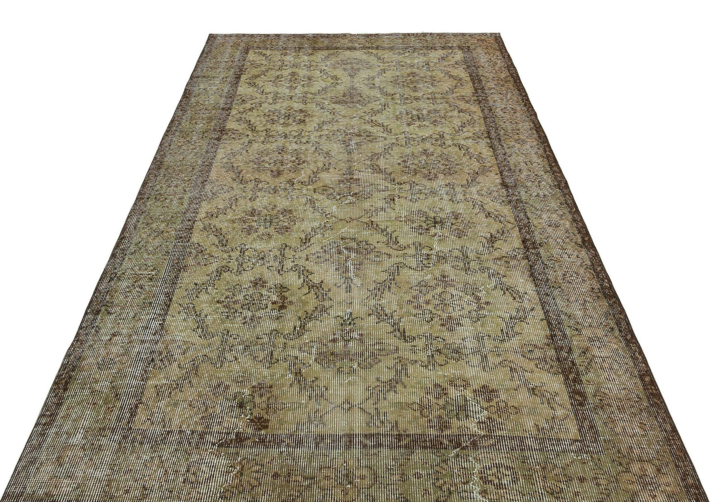 Distressed olive and brown vintage rug with a faded floral medallion pattern and a wide decorative border.
