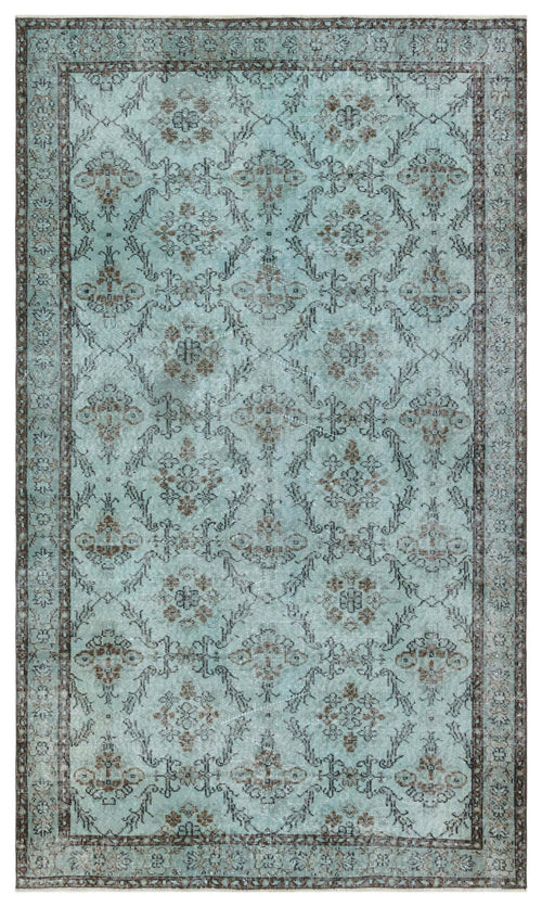 Load image 1 in gallery view. Light blue distressed rug with a dark brown floral medallion pattern and a geometric lattice border.
