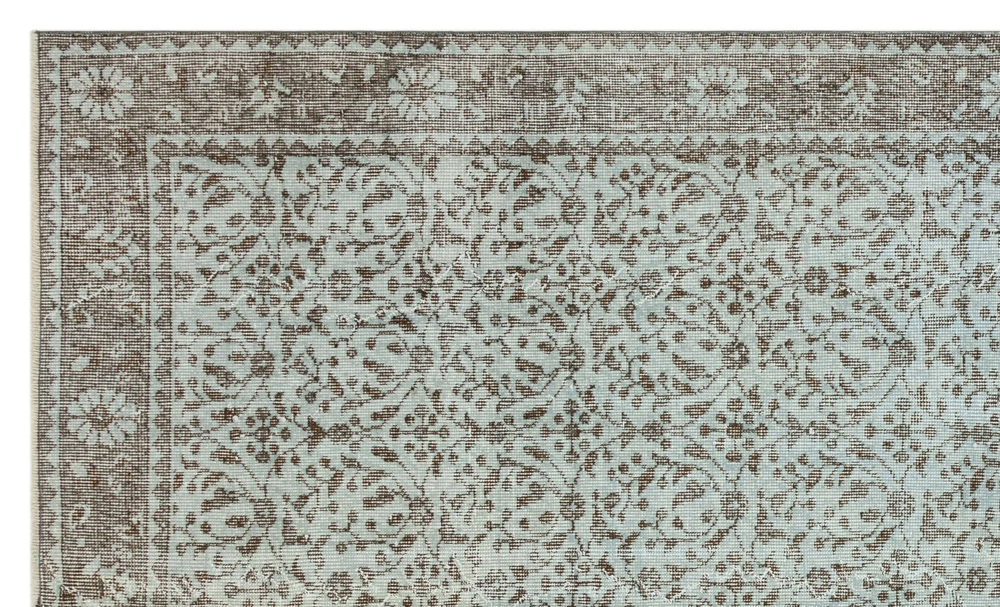 Light blue and brown rug with a traditional floral medallion pattern and a detailed border.