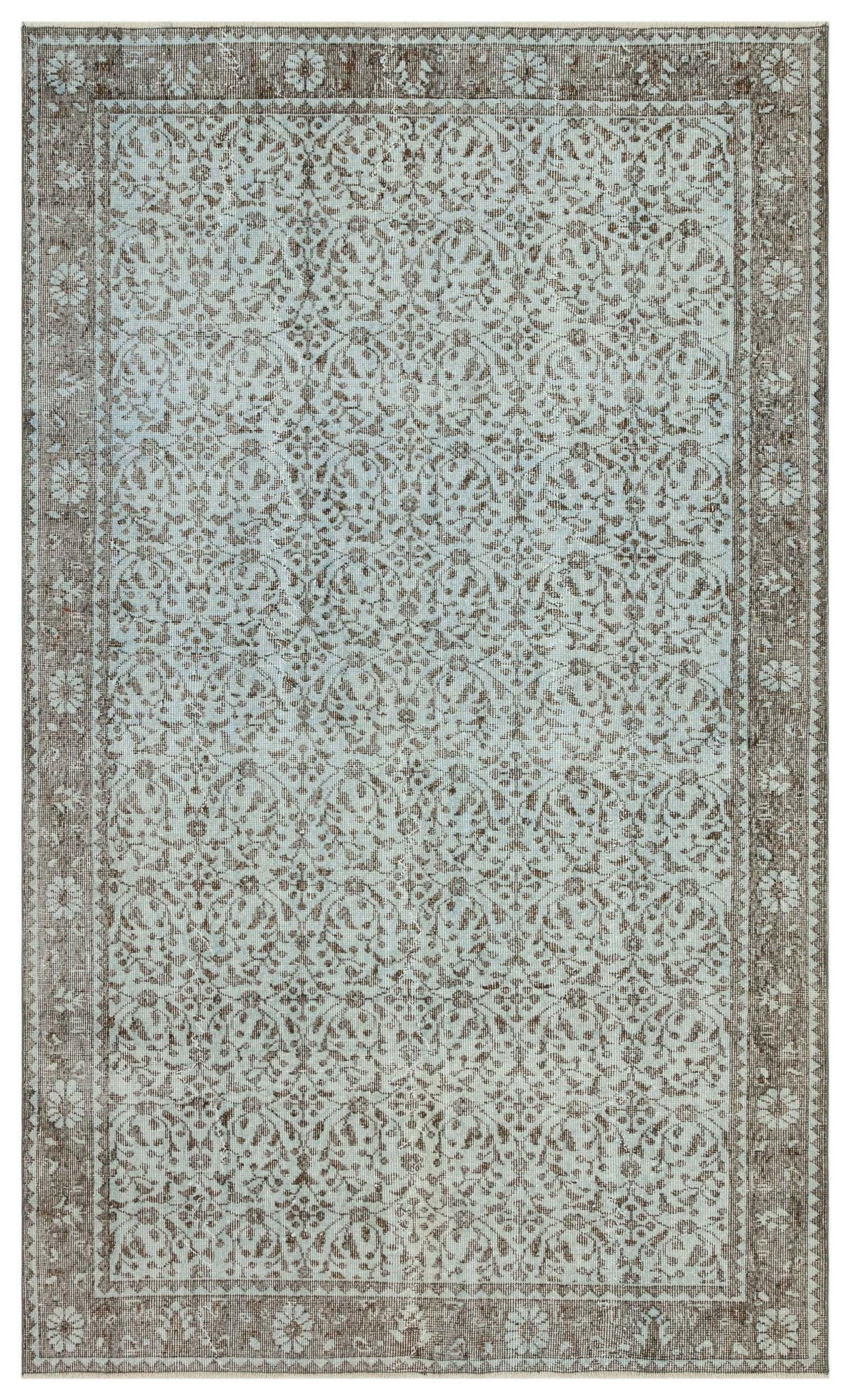 Light blue and brown traditional rug with a distressed floral medallion pattern and a wide decorative border.