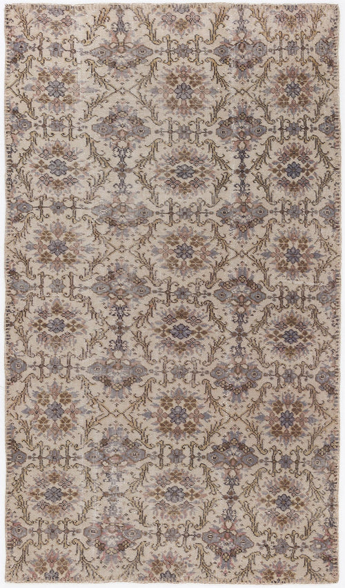 Load image 1 in gallery view. Beige and grey traditional rug with a repeating floral medallion pattern and distressed finish.