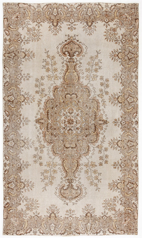 Load image 1 in gallery view. Beige and brown distressed rug with a central floral medallion and ornate border pattern.