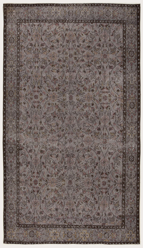 Load image 1 in gallery view. Grey and brown vintage-style rug with a distressed floral medallion pattern and a dark decorative border.