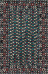 Patterned rug with a blue and red design on a dark background