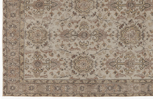 Load image 1 in gallery view. Beige and taupe traditional rug with a distressed floral medallion pattern and a decorative border.