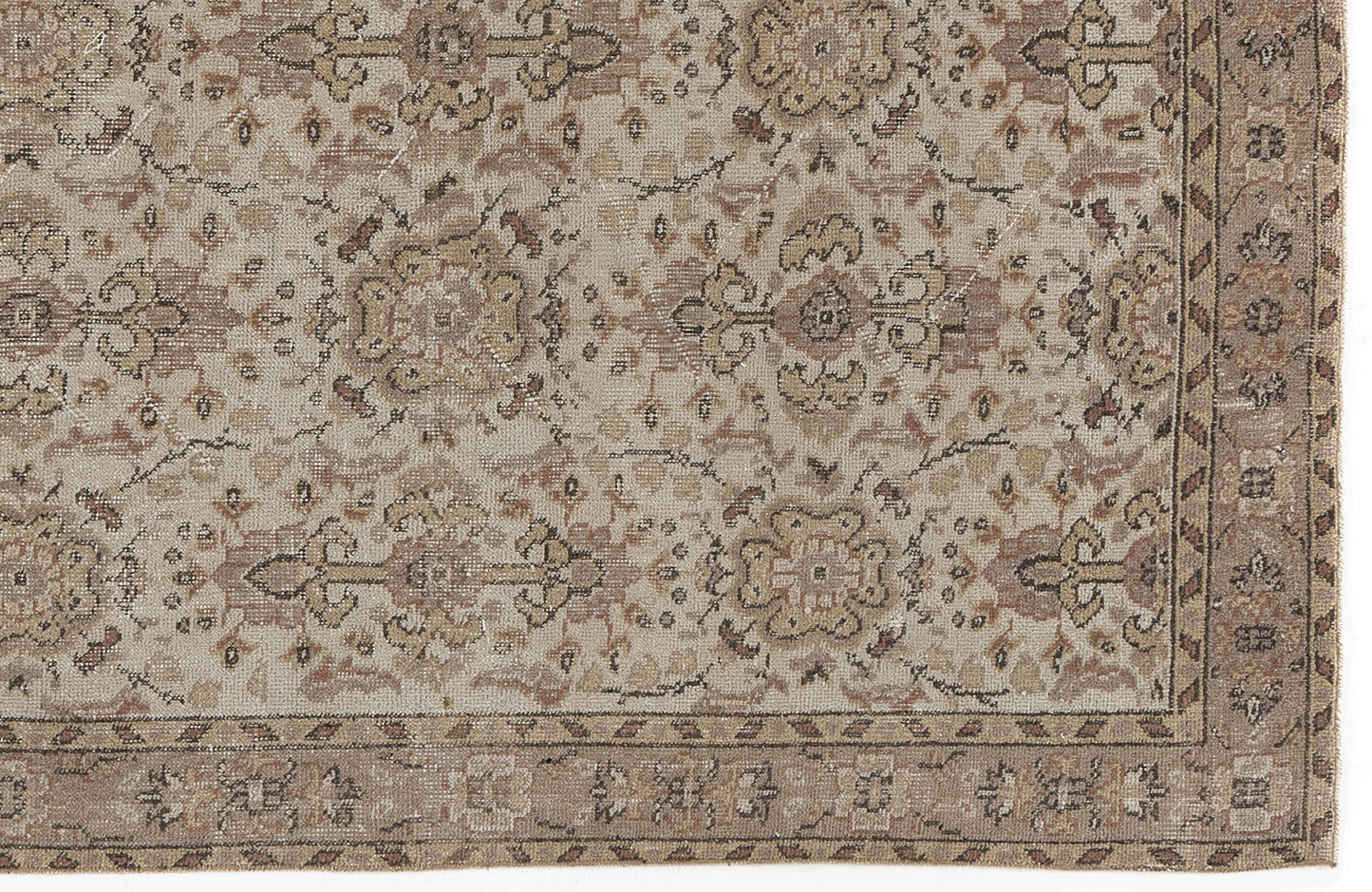 Beige and brown vintage-style rug with a distressed floral medallion pattern and a decorative border.