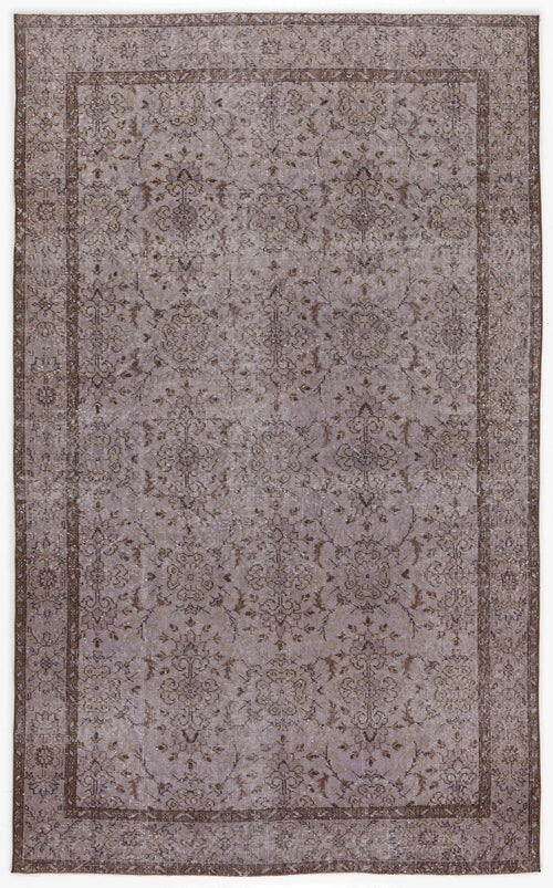 Load image 1 in gallery view. Distressed lavender and brown rug with a traditional floral medallion pattern and a wide decorative border.