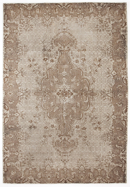 Load image 1 in gallery view. Taupe and cream distressed rug with a central floral medallion and an intricate geometric border pattern.
