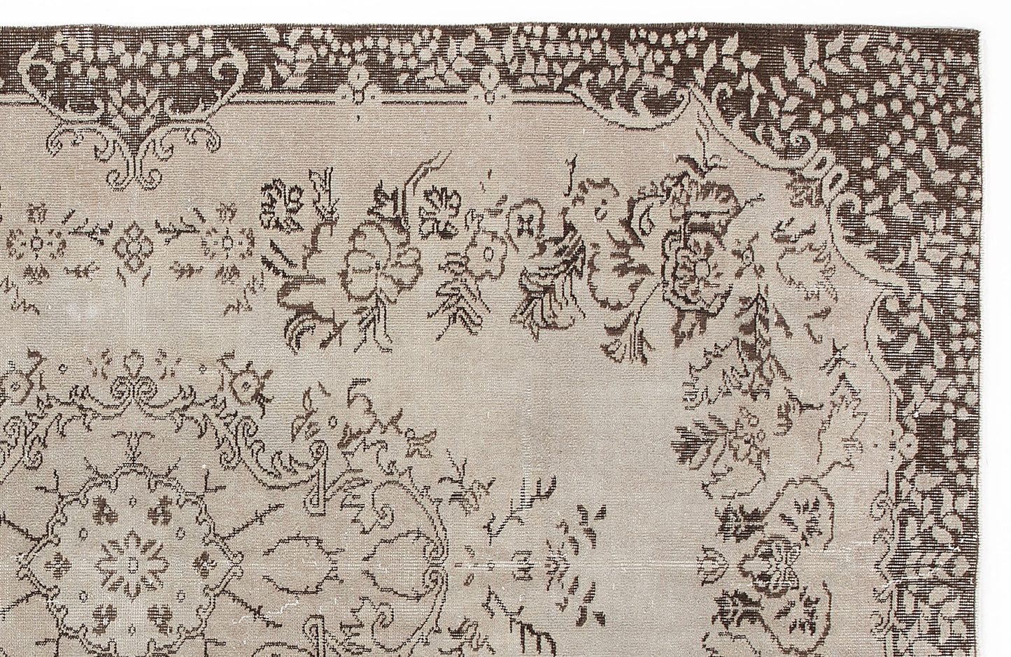Beige and dark brown traditional rug with a floral medallion and ornate border pattern.