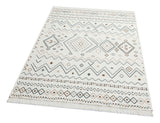 The Sand Horizon - Washable Double-Sided Kilims - AR05 is a rectangular, cream-colored rug with geometric brown, gray, and beige patterns and fringe on the shorter edge. It’s fully washable and features a reversible design.