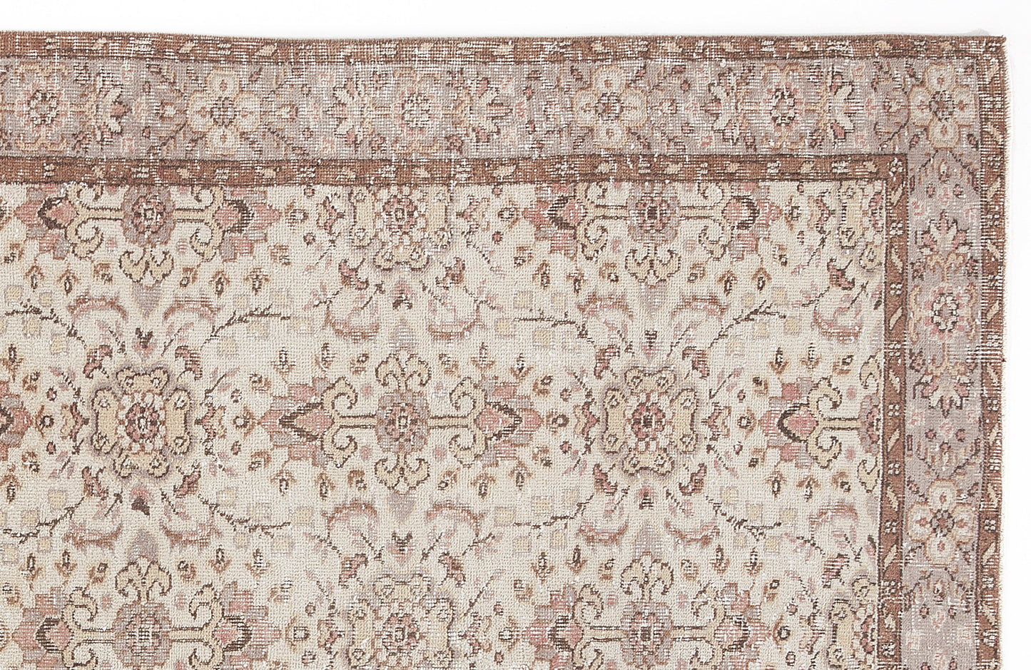 Beige and brown traditional rug with a distressed floral medallion pattern and a decorative border.