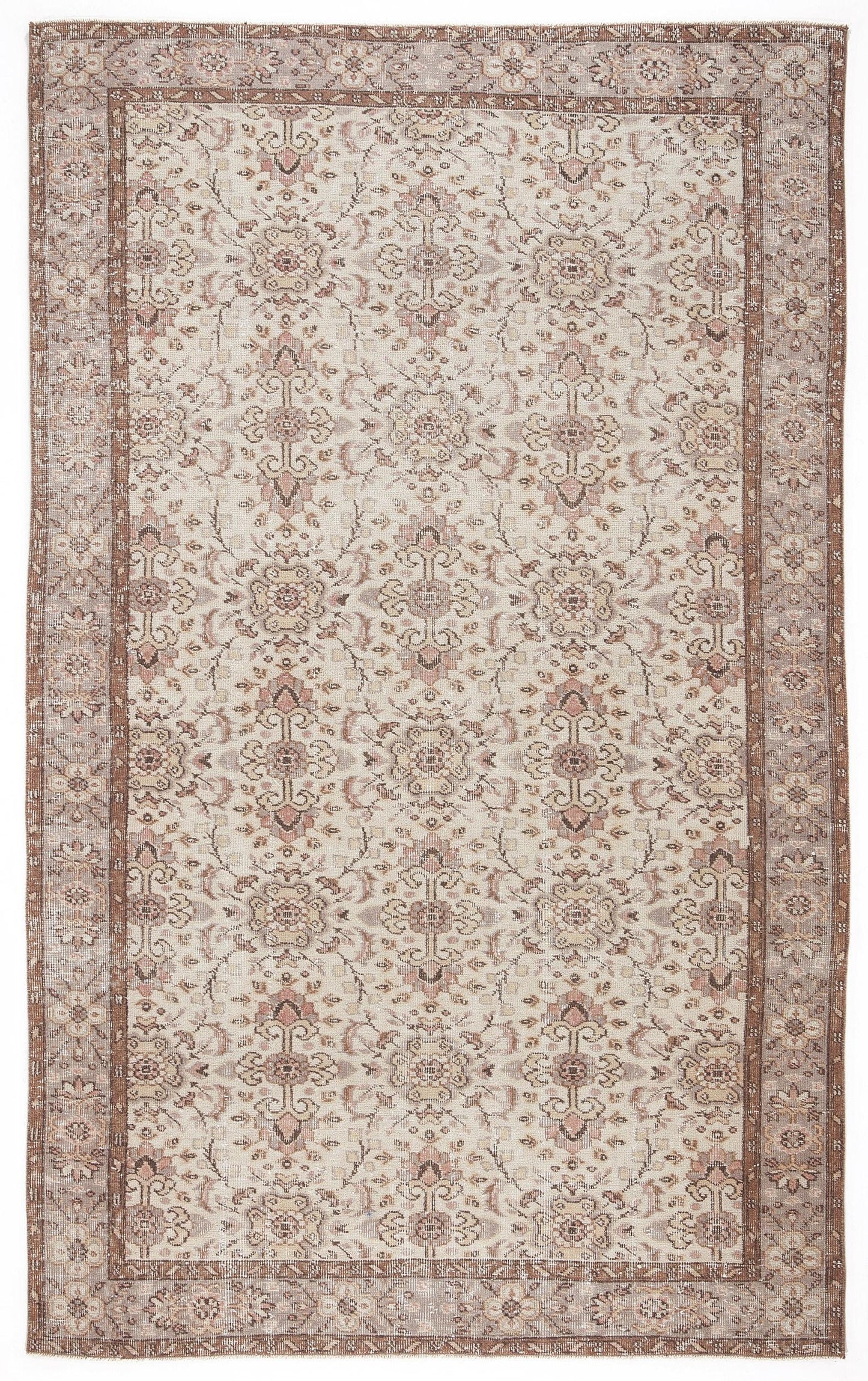 Beige and muted rose vintage-style rug with a traditional floral medallion pattern and a wide decorative border.