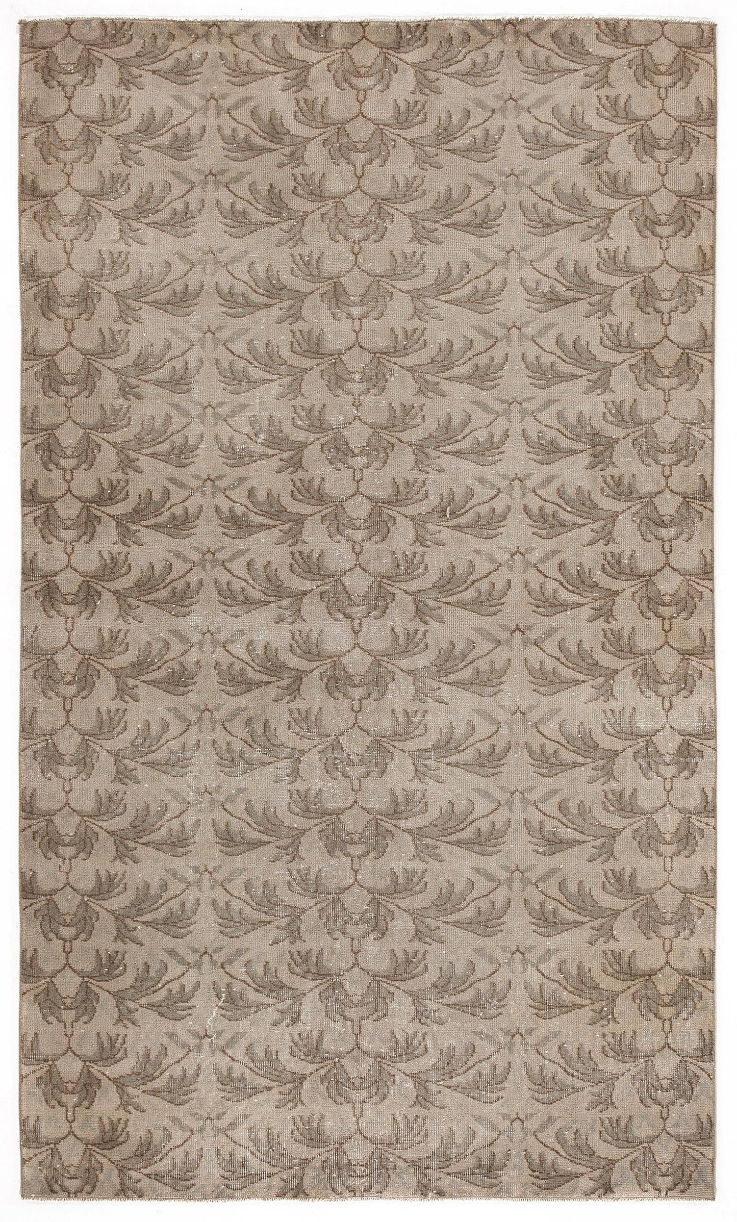 Taupe and beige rug with a repeating symmetrical leaf or feather pattern on a white background.