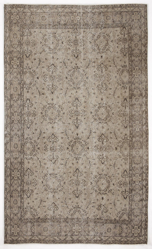 Load image 1 in gallery view. Taupe and charcoal distressed rug with a traditional floral medallion pattern and a decorative border.